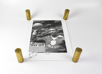 Lot 410 - PELE; a black and white photograph/poster...