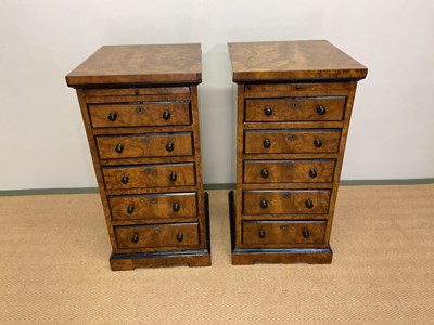 Lot 400 - A pair of figured walnut and ebonised bedside...