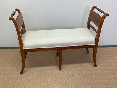 Lot 443 - A reproduction stained beech window seat with...