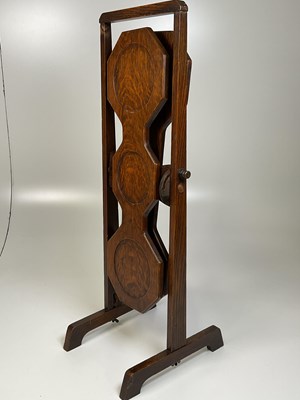Lot 521 - An oak folding double cake stand.