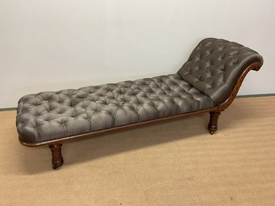 Lot 417 - A late Victorian oak day bed with button silk...