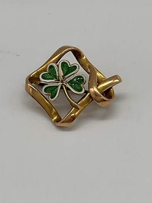 Lot 1223 - A 15ct yellow gold and enamel decorated brooch...