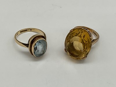 Lot 1239 - A 9ct yellow gold citrine ring, size G and a...