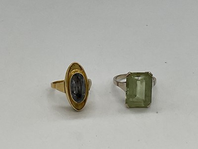 Lot 1221 - A 14ct yellow gold dress ring set with pale...