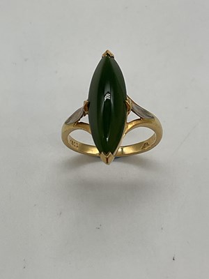 Lot 1199 - An 18ct yellow gold jade boat shaped ring,...
