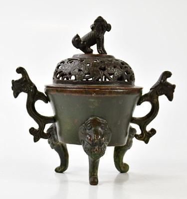 Lot 1594 - A Japanese bronze koro and cover, with...