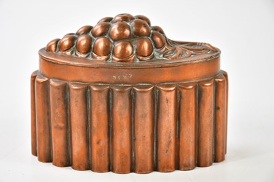 Lot 1128 - A copper jelly mould relief decorated with...