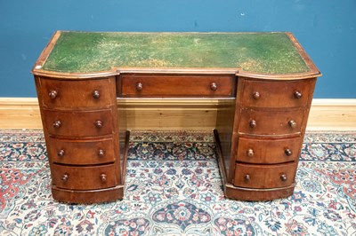 Lot 2398 - A Victorian mahogany nine drawer kneehole desk...