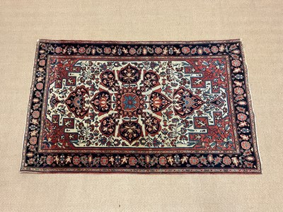 Lot 358 - An Indian inspired rug with central floral...