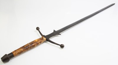 Lot 711 - A reproduction cast metal broadsword with...