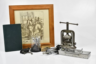 Lot 1018 - An unusual cast metal press, a hardbook book...