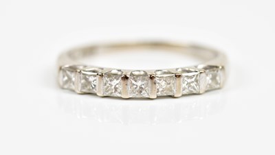 Lot 2173 - An 18ct white gold seven stone half eternity...