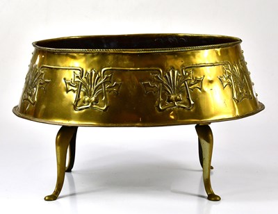 Lot 1134 - An Arts and Crafts brass planter of shaped...