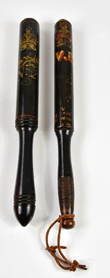 Lot 446 - Two 19th century black lacquered truncheons,...