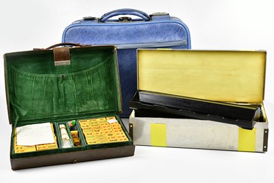 Lot 1595 - A vintage leather cased Mahjong set with metal...