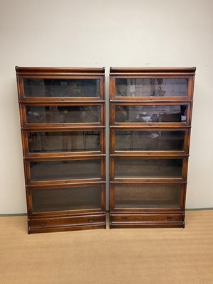 Lot 389 - GLOBE WERNICKE; a pair of oak bookcases,...