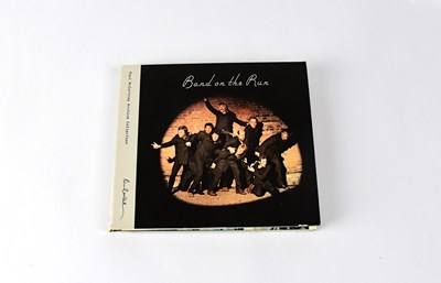 Lot 264 - WINGS; CD, 'Band On The Run', signed to...