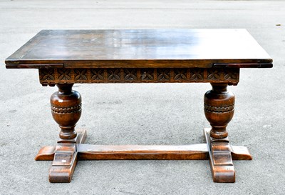 Lot 2349 - An oak draw-leaf refectory type dining table...
