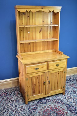 Lot 2594 - A modern pine kitchen dresser, width 92cm.