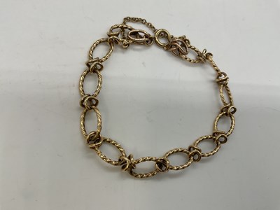 Lot 1202 - A 9ct yellow gold open oval link bracelet,...