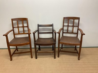 Lot 525 - A pair of Arts and Crafts oak open elbow...