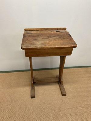 Lot 477 - A vintage child's pine school desk with...