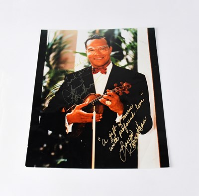Lot 351 - LOUIS FARRAKHAN; a colour photograph signed by...