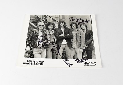 Lot 175 - TOM PETTY & THE HEARTBREAKERS; a black and...
