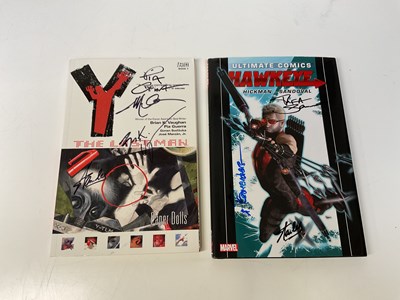 Lot 2309 - COMIC BOOKS; two books, Hawkeye, signed by...