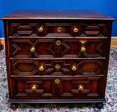 Lot 2340 - An 18th century oak chest of four long drawers,...