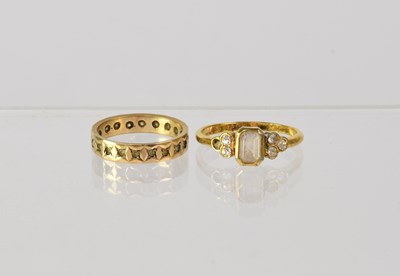 Lot 842 - Two 9ct gold rings, comprising a band ring set...