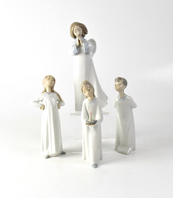 Lot 573 - LLADRÓ; four figures of children in night...