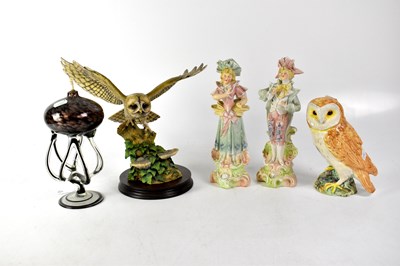 Lot 179 - A stoneware model of an owl on a stylised rocky and ivy plinth