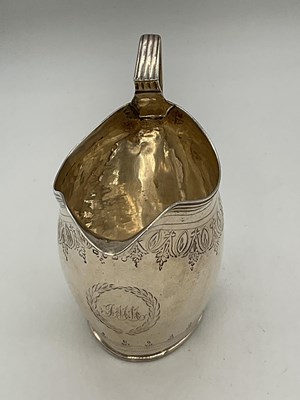 Lot 1085 - A George III hallmarked silver helmet shaped...