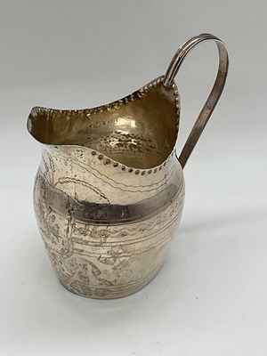 Lot 1128 - A George III hallmarked silver helmet shaped...