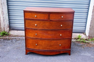 Lot 2579 - A reproduction bowfront chest of two short...