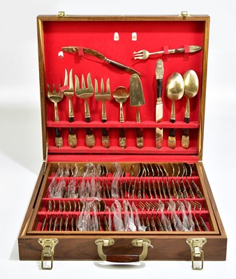 Lot 2002 - A teak case of Thai brass and wooden cutlery.
