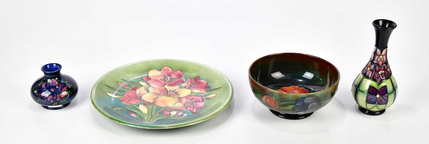 Lot 85 - WALTER MOORCROFT; a footed bowl, decorated in...