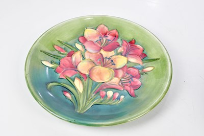 Lot 85 - WALTER MOORCROFT; a footed bowl, decorated in...