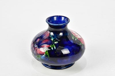 Lot 85 - WALTER MOORCROFT; a footed bowl, decorated in...