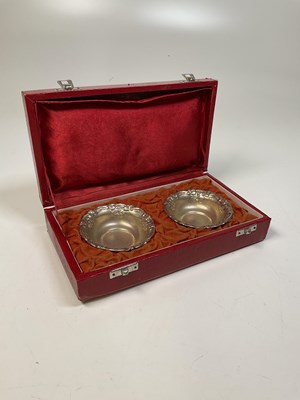 Lot 1119 - A pair of white metal circular small bowls...