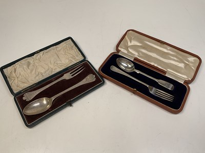 Lot 1098 - Two cased sets of christening spoon and fork,...