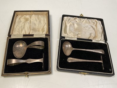 Lot 1099 - Two cased George V hallmarked silver sets...