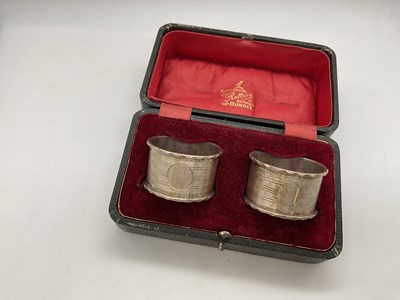 Lot 1121 - A pair of George V hallmarked silver napkin...
