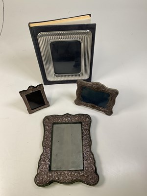 Lot 1056 - A silver fronted velvet easel backed...
