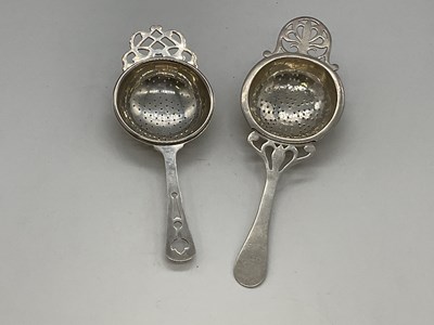 Lot 1095 - Two hallmarked silver tea strainers with...