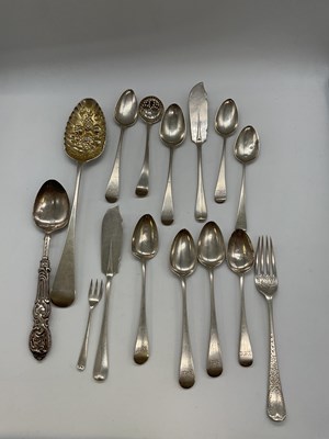 Lot 1019 - A group of silver flatware including a George...