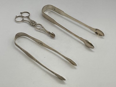 Lot 1059 - A pair of George III hallmarked silver sugar...