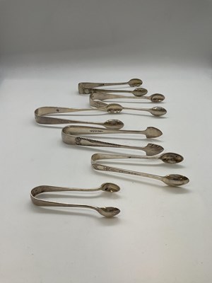 Lot 1045 - Five pairs of hallmarked silver sugar tongs...