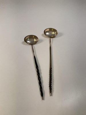 Lot 1126 - Two Georgian toddy ladles with white metal...